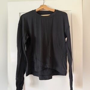 Lululemon Black Layered Hem pullover with zipper pocket detail for phone